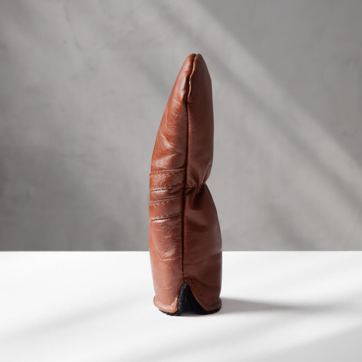 Side angle of handcrafted leather fairway wood golf cover highlighting slim fit design.