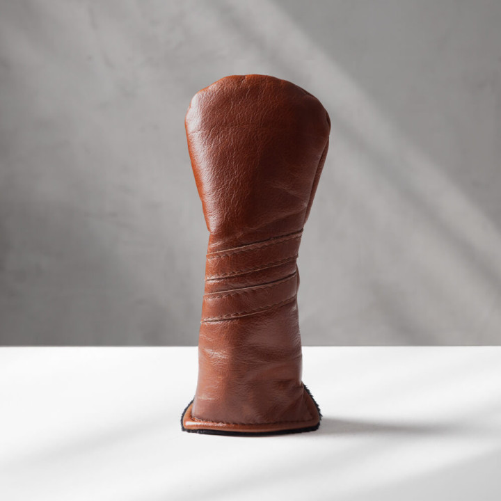 Side angle of handcrafted leather fairway wood golf cover highlighting slim fit design.