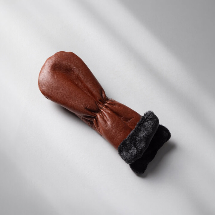 Close-up of padded leather protection and seam stitching on hybrid club headcover.
